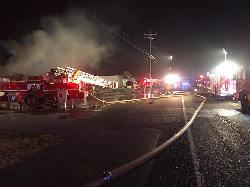 Photo contributed by Dunlap Fire Department
Firefighters on Thursday battle a blaze at Land's Restaurant in Dunlap.