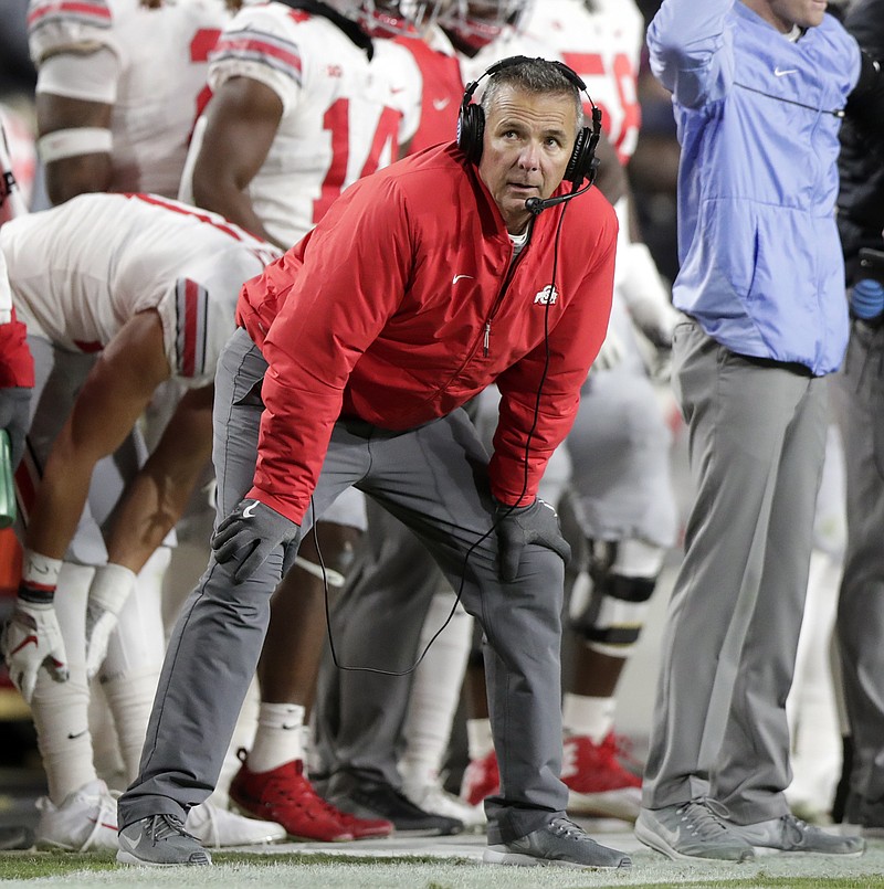 Retiring Ohio State coach Urban Meyer, shown during the Oct. 20 loss to Purdue, is still intensely involved in all aspects of practice but seems "at peace," Buckeyes players say.