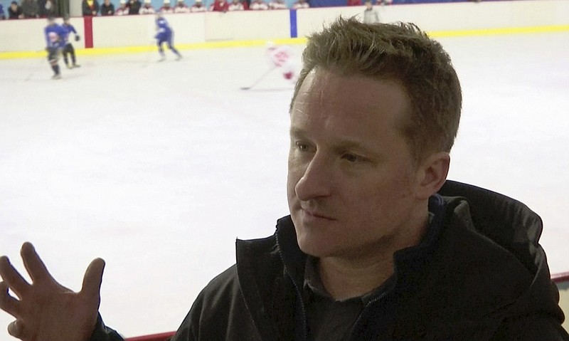 In this image made from video taken on March 11, 2016, entrepreneur Michael Spavor speaks during a friendly ice hockey match between visiting foreigners and North Korean players in Pyongyang, North Korea. A second Canadian man is feared detained in China in what appears to be retaliation for Canada's arrest of a top executive of telecommunications giant Huawei. The possible arrest raises the stakes in an international dispute that threatens relations. Canada's Global Affairs department on Wednesday, Dec. 12, 2018, said Spavor, an entrepreneur who is one of the only Westerners to have met North Korean leader Kim Jong Un, had gone missing in China. Spavor's disappearance follows China's detention of a former Canadian diplomat in Beijing earlier this week. (AP Photo)