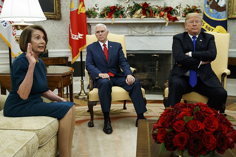 Vice President Mike Pence, center, listens as President Donald Trump argues with House Minority Leader Rep. Nancy Pelosi, D-California, during a meeting in the Oval Office of the White House on Tuesday. (AP Photo/Evan Vucci)
