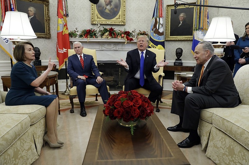 In this Dec. 11, 2018, photo, President Donald Trump and Vice President Mike Pence meet with Senate Minority Leader Chuck Schumer, D-N.Y., and House Minority Leader Nancy Pelosi, D-Calif., in the Oval Office of the White House in Washington. Congress is racing to avoid a partial government shutdown over President Donald Trump's border. But you wouldn't know it by the schedule. Lawmakers are away until next week. The ball is in Trump's court, both sides say. (AP Photo/Evan Vucci)