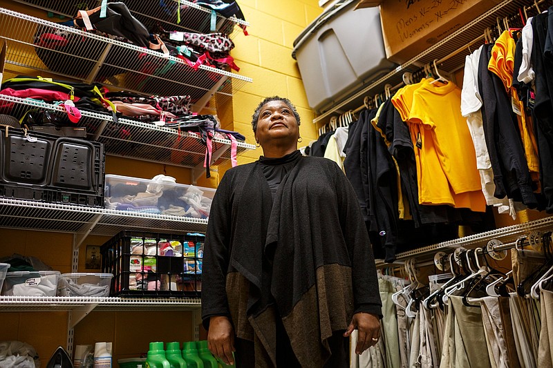 Parent volunteer coordinator Tonya Turman poses for a portrait inside the school's care closet at Orchard Knob Middle School on Wednesday, Dec. 12, 2018, in Chattanooga, Tenn. The care closet, which features clothing, hygiene supplies and other items for students, is being expanded to all of the county's Opportunity Zone schools.