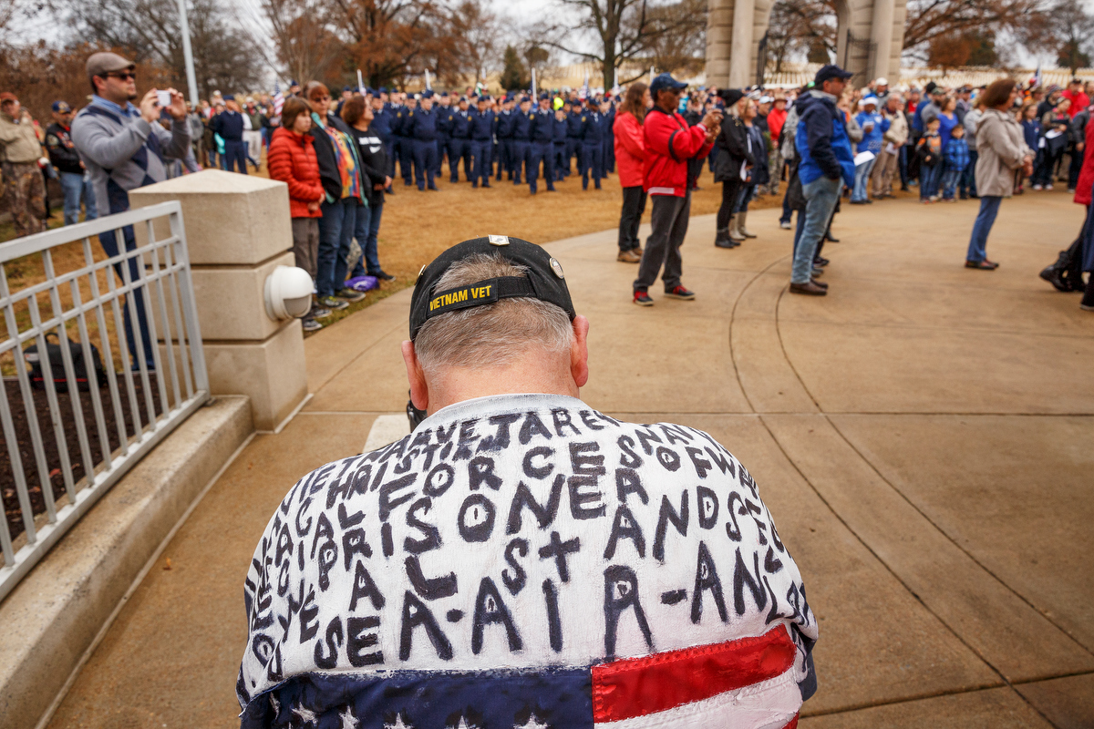 Staff photo by Doug Strickland / Bill Joe Stockwell, Sr., bows his head during a memorial ceremony at the Chattanooga National Cemetery on Saturday, Dec. 15, 2018, in Chattanooga, Tenn. Thousands of volunteers turned out to lay wreaths on graves at the cemetery which were donated by the Worcester Wreath Company through the Wreaths Across America program, which supplies wreaths to national cemeteries across the country.
