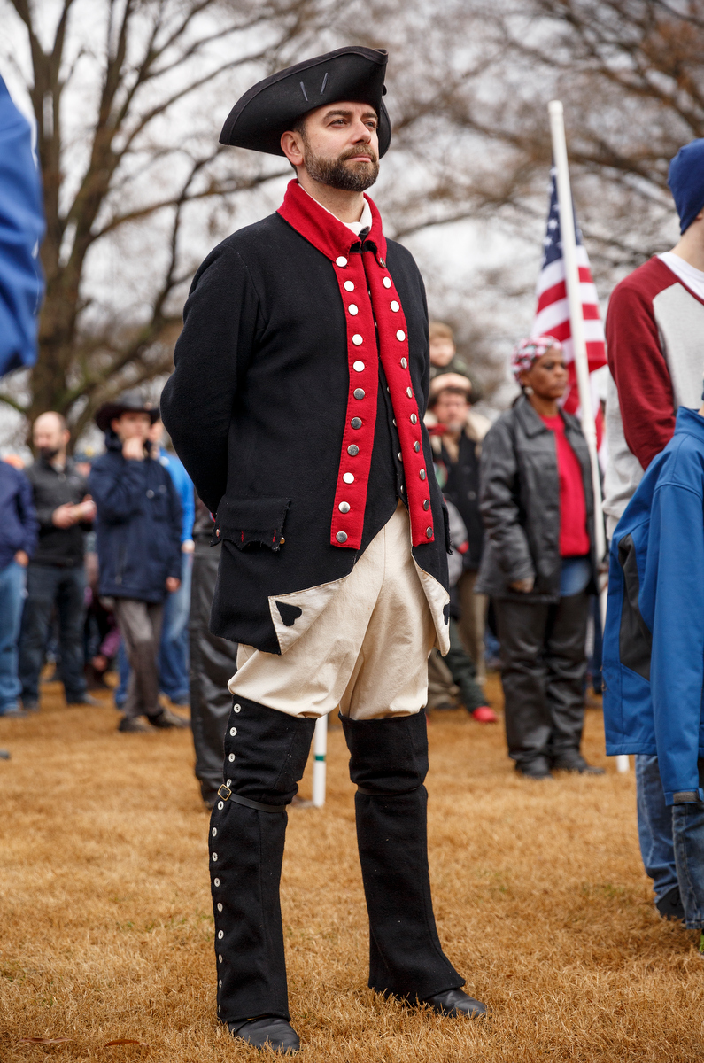 Staff photo by Doug Strickland / Joe White with the Col. Benjamin Cleveland chapter of the Sons of the American Revolution listens to a memorial ceremony at the Chattanooga National Cemetery on Saturday, Dec. 15, 2018, in Chattanooga, Tenn. Thousands of volunteers turned out to lay wreaths on graves at the cemetery which were donated by the Worcester Wreath Company through the Wreaths Across America program, which supplies wreaths to national cemeteries across the country.