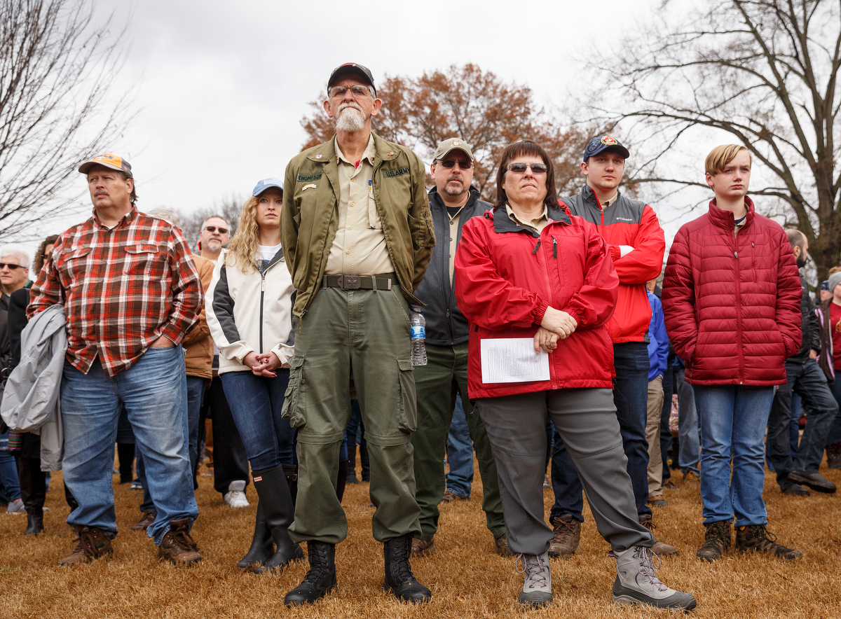Staff photo by Doug Strickland / People listen to a memorial ceremony at the Chattanooga National Cemetery on Saturday, Dec. 15, 2018, in Chattanooga, Tenn. Thousands of volunteers turned out to lay wreaths on graves at the cemetery which were donated by the Worcester Wreath Company through the Wreaths Across America program, which supplies wreaths to national cemeteries across the country.
