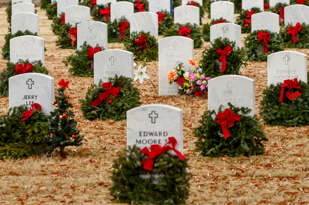 Staff photo by Doug Strickland / Wreaths are seen on graves at the Chattanooga National Cemetery on Saturday, Dec. 15, 2018, in Chattanooga, Tenn. Thousands of volunteers turned out to lay wreaths on graves at the cemetery which were donated by the Worcester Wreath Company through the Wreaths Across America program, which supplies wreaths to national cemeteries across the country.