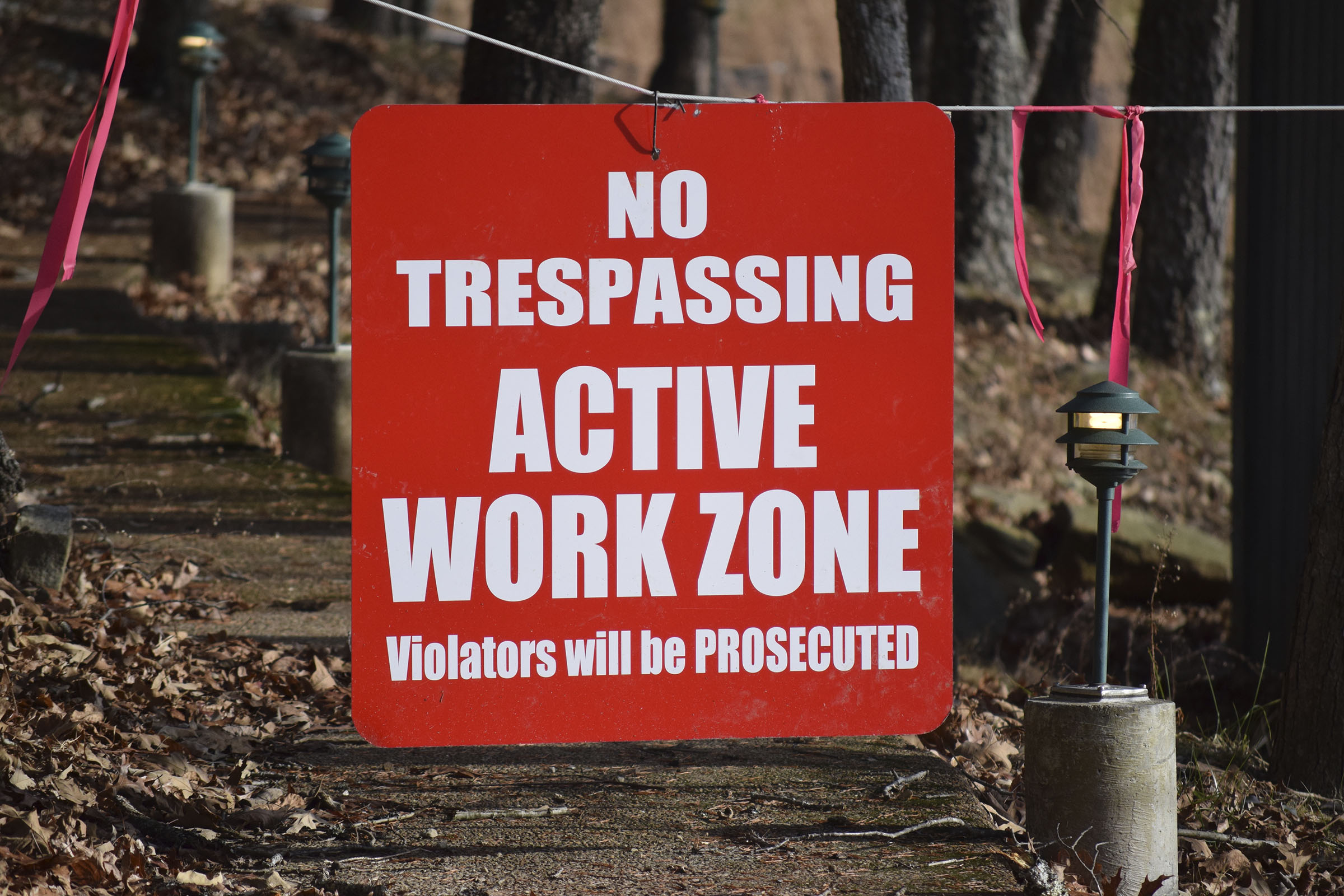 A sign stands across a pathway to the site of the former Fall Creek Falls State Park Inn on Dec. 13, 2018.