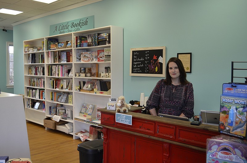 Collegedale resident Miranda Atkins stands inside A Little Bookish, the book and toy store she opened recently in Ooltewah.