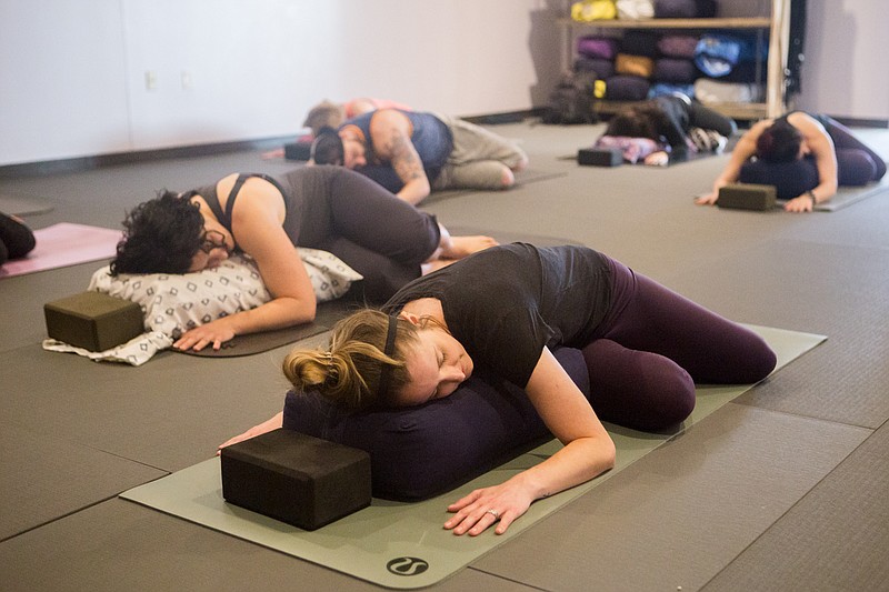 The CBD yoga class at Thrive Yoga and Wellness combines restorative yoga with CBD oil to balance the mind and body, says studio owner Jennifer Dixon.