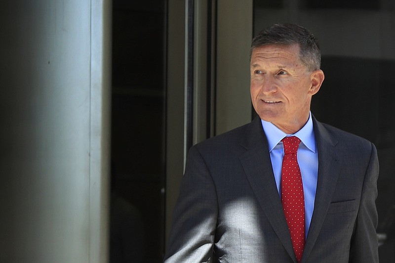 In this July 10, 2018, file photo, former Trump national security adviser Michael Flynn leaves the federal courthouse in Washington, following a status hearing. Michael Flynn may have given extraordinary cooperation to prosecutors, but the run-up to his sentencing hearing has exposed tensions over an FBI interview in which the former national security adviser lied about his Russian contacts. (AP Photo/Manuel Balce Ceneta, File)
