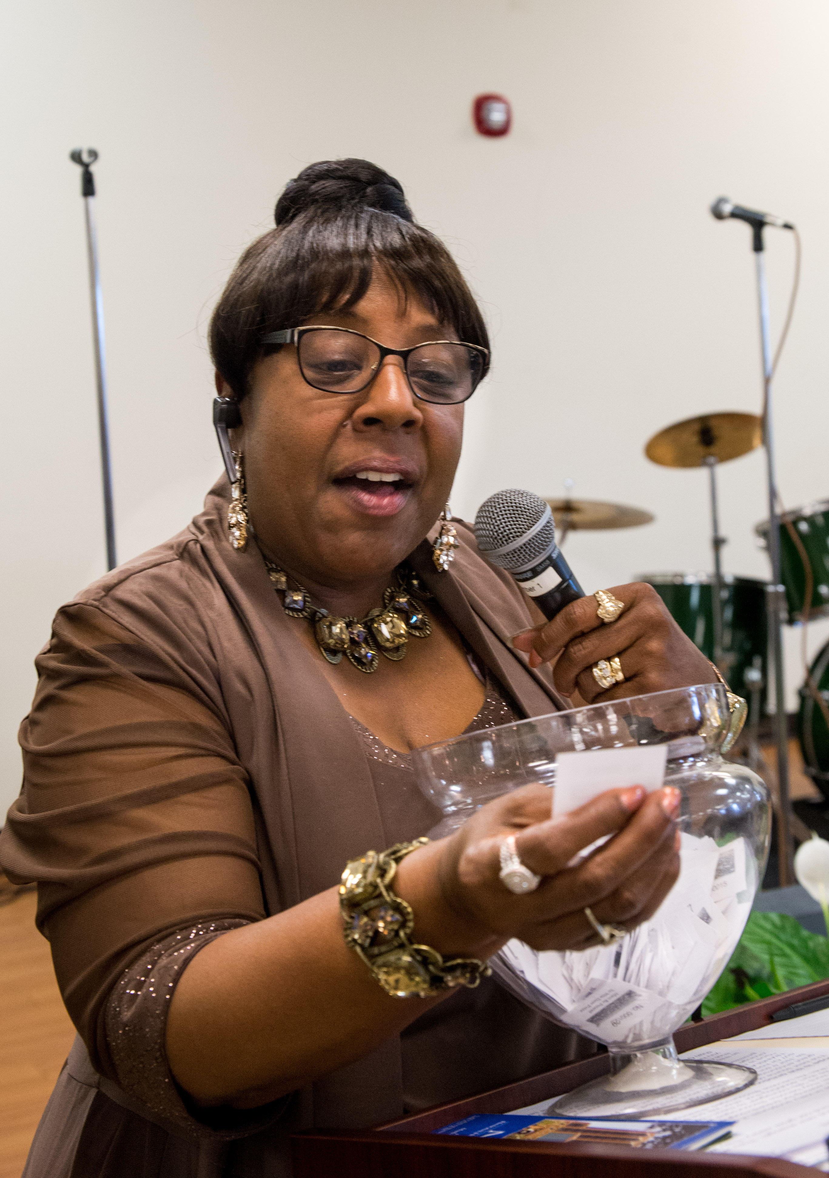 Tajuana Mitchell calls out door prizes.