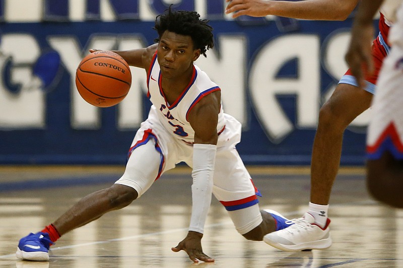 Red Bank's Michael Watkins (3) finds his balance while dribbling against Brainerd at Susan Ingram Thurman Gymnasium on the campus of Red Bank High School on Tuesday, Dec. 18, 2018 in Chattanooga, Tenn.