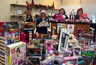 Lookout Valley Chiropractic staff, from left, Nikki Branch, Reidun Paulsen, Suzanne Gribble and Annette Blanks, are shown with toys donated by patients to the Lookout Valley Lions Club.