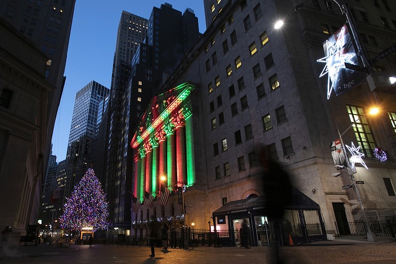 In this Dec. 11, 2018, file photo, the New York Stock Exchange is bathed in holiday light, in New York. U.S. stocks are slightly lower Thursday morning, Dec. 20, a day after another big plunge rocked markets around the world. Asian and European indexes suffered bigger losses. Stocks have tumbled as investors grow increasingly worried the U.S. could slip into a recession in the next few years. (AP Photo/Mark Lennihan, File)