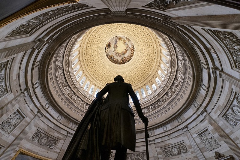 The statue of George Washington is seen beneath the Rotunda in the Capitol in Washington, Thursday, Dec. 20, 2018. The House passed an extensive criminal justice bill Thursday that will reduce some of the harshest sentences for federal drug offenders and boost prison rehabilitation programs. The bill passed 358-36 and now goes to President Donald Trump for his signature. (AP Photo/J. Scott Applewhite)