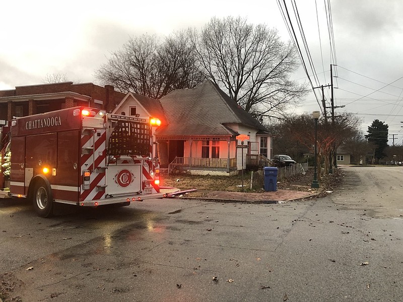 Chattanooga firefighters work the scene of a fire that spread from a kitchen into other parts of a Peachtree Street  home on Friday, Dec. 21, 2018. / Photo by Battalion Chief Ashley May