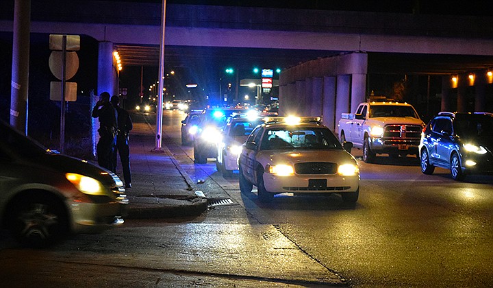 Staff photo by Mark Pace/Chattanooga Times Free Press — Police respond to Exit 178 after a man was shot in the hand while traveling down Interstate 24 Saturday evening. At least three people were shot Saturday in Hamilton County.