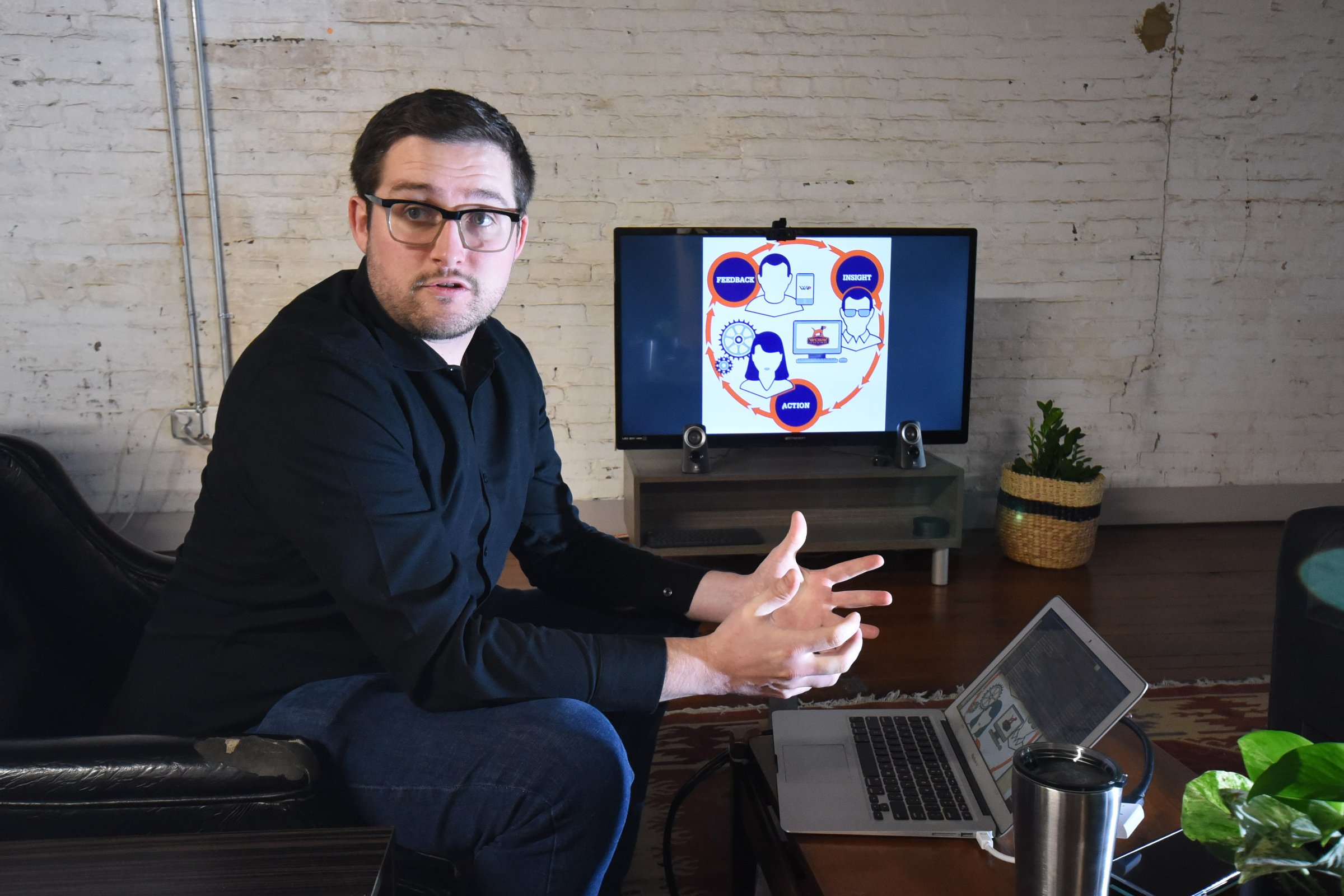 Max Farrell, CEO of Work Hound, talks about his mobile platform in the Cherry Street offices. Presently, the company assists truck drivers with anonymous complaints to their employers.