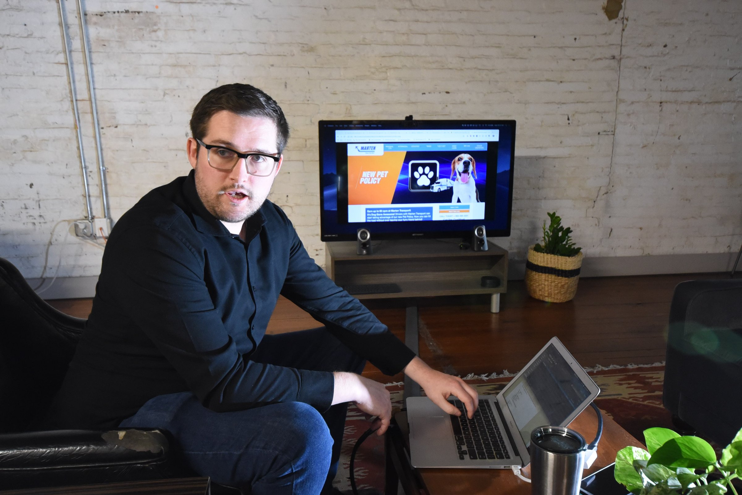 Max Farrell, CEO of Work Hound, talks about his mobile platform in the Cherry Street offices. Presently, the company assists truck drivers with anonymous complaints to their employers.