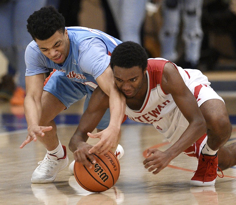 Brainerd's Jonte Williams, left, and Ooltewah's Julien Walker dive for a loose ball during their Best of Preps Tournament game Thursday at Chattanooga State.