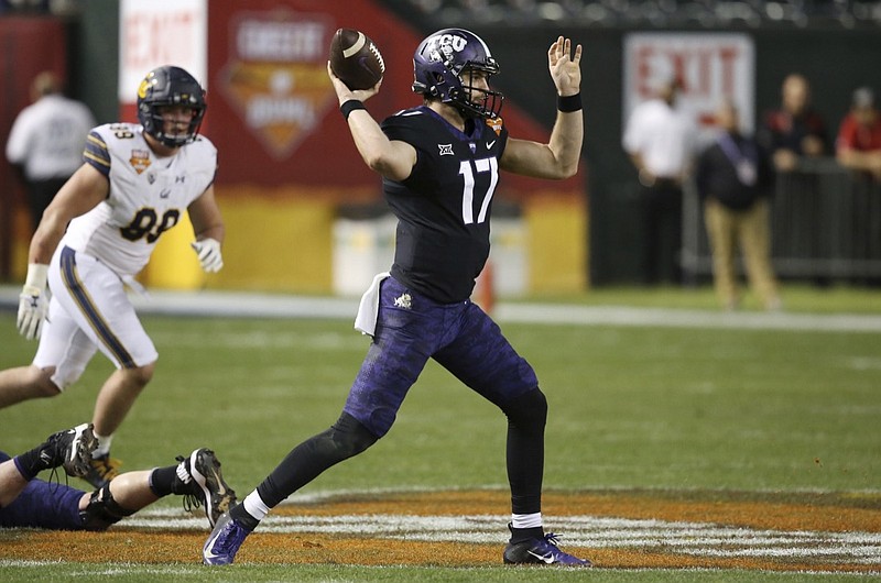 TCU quarterback Grayson Muehlstein (17) throws a pass as California linebacker Evan Weaver, left, watches during the first half of the Cheez-It Bowl NCAA college football game Wednesday, Dec. 26, 2018, in Phoenix. (AP Photo/Ross D. Franklin)