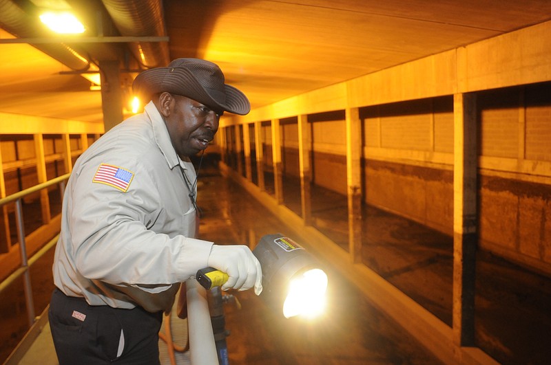 Pump station technician/inspector Luther Bibb in 2010 walks through a combined sewer overflow facility for Chattanooga's Moccasin Bend Wastewater Treatment Plant.