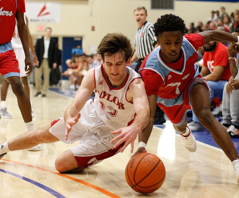 Baylor's Greyson Linderman, left, and Brainerd's Remeo Hubbard dive for a loose ball during a Best of Preps tournament semifinal Friday at Chattanooga State.