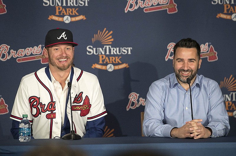 Atlanta Braves general manager Alex Anthopoulos, right, and Josh Donaldson laugh during a baseball press conference Tuesday, Nov. 27, 2018, in Atlanta. (Alyssa Pointer/Atlanta Journal-Constitution via AP)