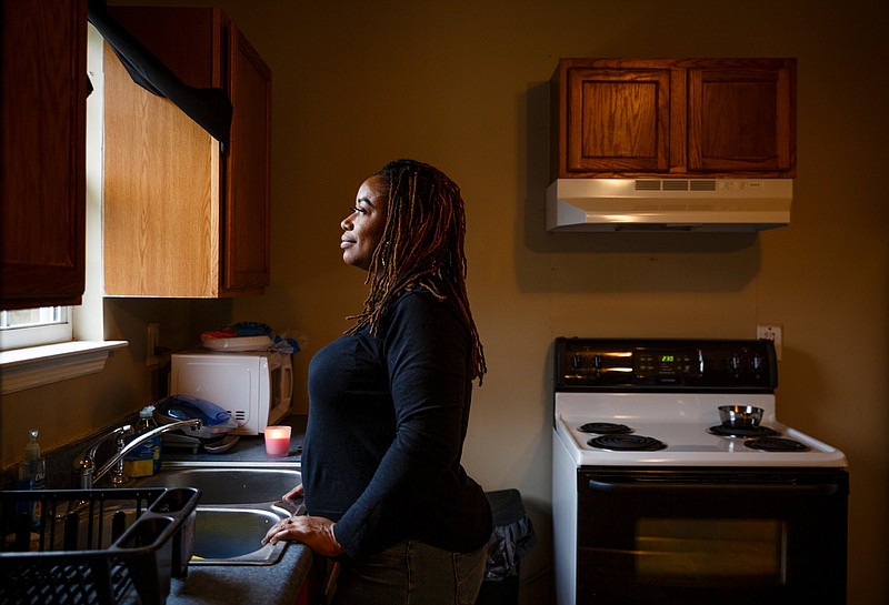 Dareece Carruthers poses for a portrait in the kitchen of her new apartment on Thursday, Dec. 27, 2018, in Chattanooga, Tenn. 