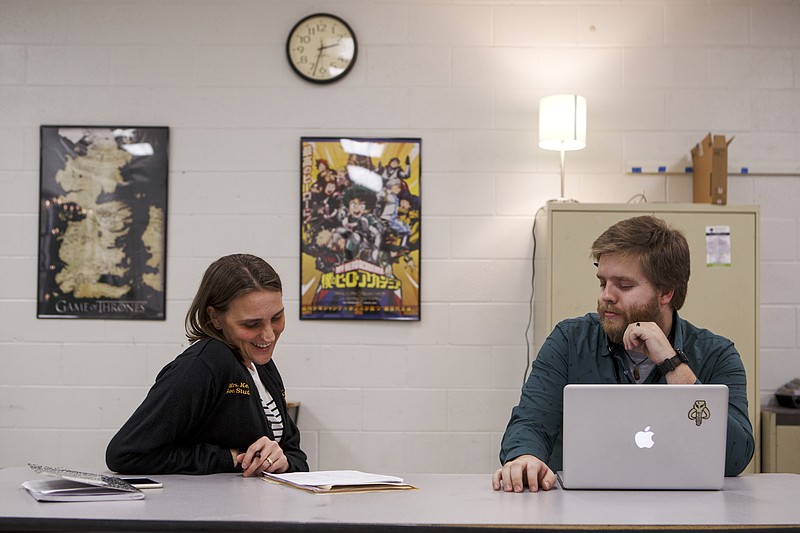 Mentor teacher Erica Kelley, left, and eighth-grade American history teacher Seaver McMichen discuss McMichen's teaching performance in his classroom at Orchard Knob Middle School on Monday, Dec. 17, 2018 in Chattanooga, Tenn.