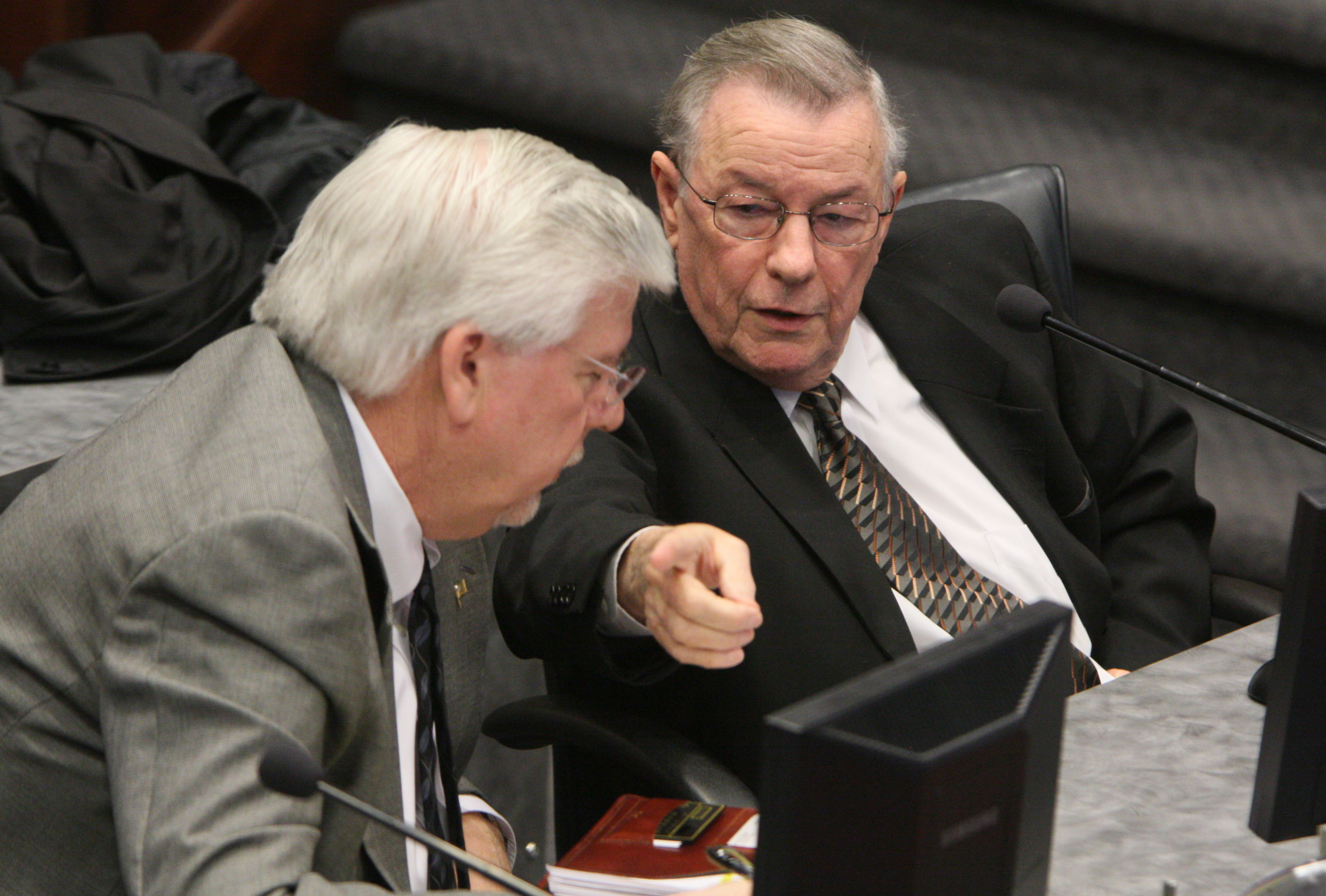 Staff Photo by Dan Henry /
Bill Bennett, the property assessor for Hamilton County, right, and his chief deputy Roy Rumfelt speak about the 2009 reappraisal where many Hamilton County property values have increased during a County Commission meeting.