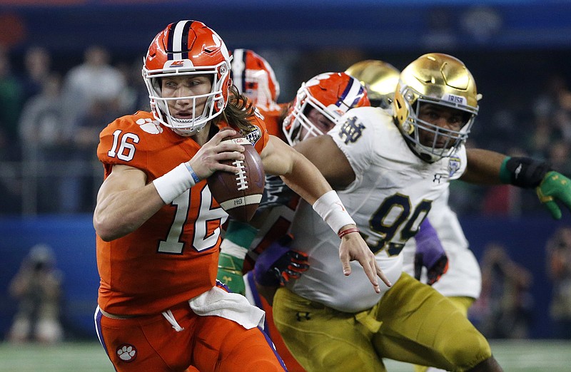 Clemson quarterback Trevor Lawrence (16) scrambles out of the pocket during the NCAA Cotton Bowl semi-final playoff football game against Notre Dame on Saturday, Dec. 29, 2018, in Arlington, Texas. (AP Photo/Michael Ainsworth)