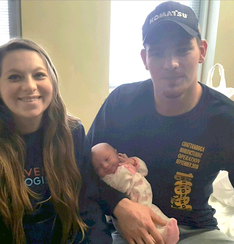 Proud parents Kristen French and Adam Bennett of Rossville, Ga., hold their newborn daughter Madelyn Rae Bennett Tuesday at Erlanger Baroness Hospital. Madelyn was the first baby of 2019 born at Erlanger.