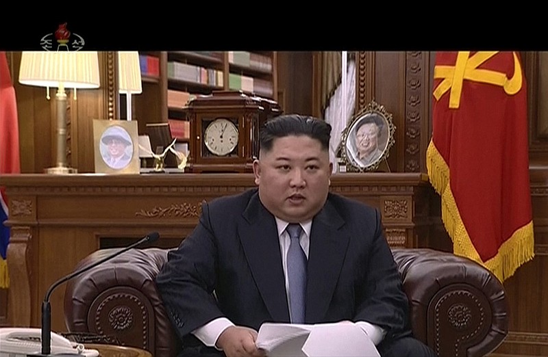 In this undated image from video distributed on Tuesday, Jan. 1, 2019, by North Korean broadcaster KRT, North Korean leader Kim Jong Un delivers a speech in North Korea. North Korean leader Kim says he hopes to extend his high-stakes nuclear summitry with President Donald Trump into 2019, but also warns Washington not to test North Koreans' patience with sanctions and pressure. (KRT via AP)