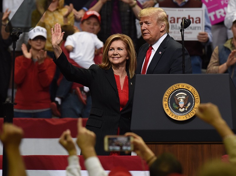 Then-Senate candidate Marsha Blackburn stands with President Donald Trump upon being introduced to a capacity crowd at McKenzie Arena during the president's stop in Chattanooga on Nov. 4, 2018.