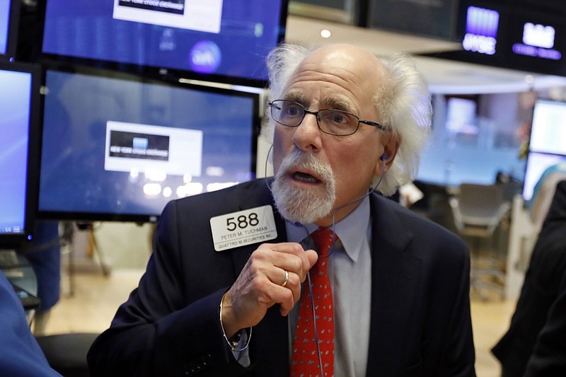Trader Peter Tuchman works on the floor of the New York Stock Exchange, Thursday, Jan. 3, 2019. Apple's shock warning that its Chinese sales are weakening ratcheted up concerns about the world's second largest economy and weighed heavily on global stock markets as well as the dollar on Thursday. (AP Photo/Richard Drew)