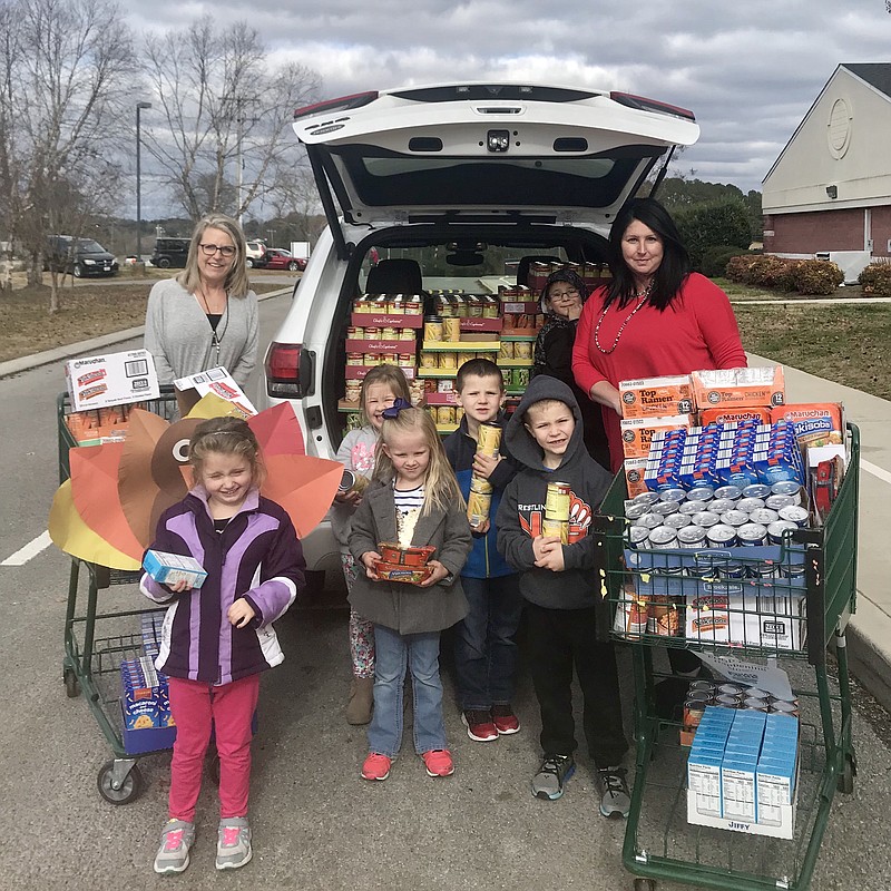 Local boutique That's So Mimi donates a total of 1,117 food items to students at Rock Spring Elementary School, with one item of food donated for each item purchased from the virtual store. (Contributed photos)