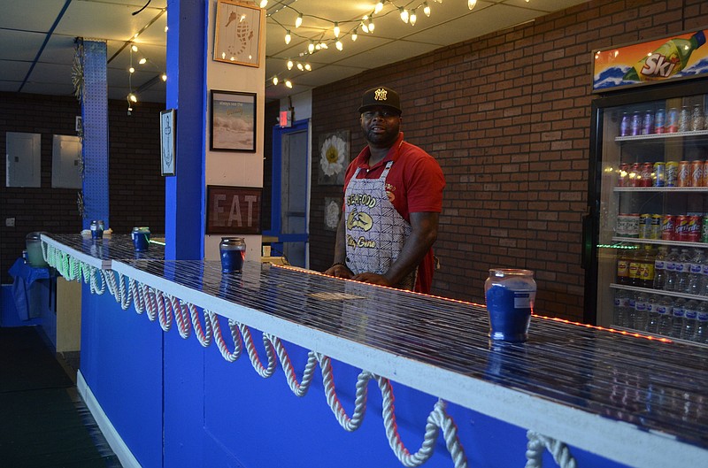 Eugene Coleman stands inside Seafood King, his new restaurant in St. Elmo.
