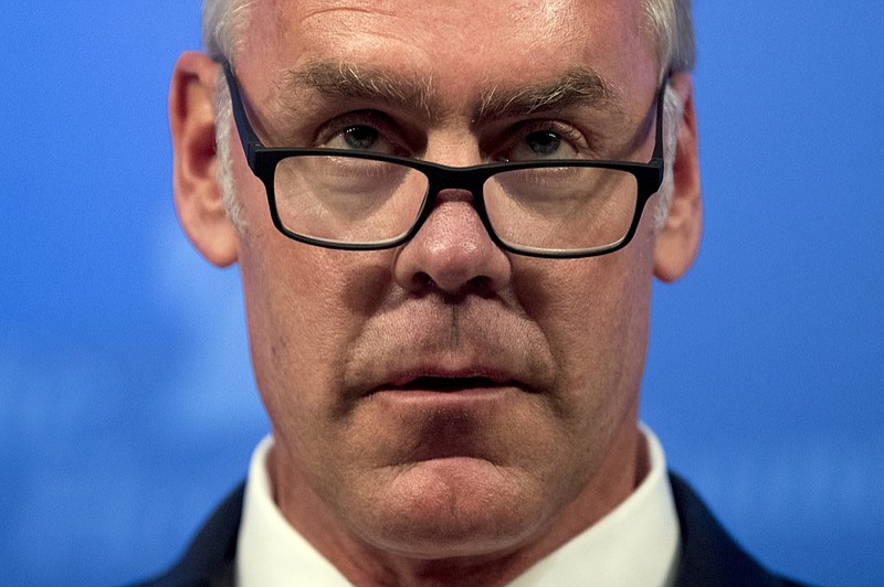 FILE - In this Sept. 29, 2017 file photo, then Interior Secretary Ryan Zinke speaks on the Trump Administration's energy policy at the Heritage Foundation in Washington. As former U.S. Interior Secretary Zinke departs Trump's Cabinet amid a cloud of investigations, he says he's lived up to the conservation ideals of Teddy Roosevelt and insists the myriad allegations against him are unfounded. Zinke told The Associated Press that he quit President Donald Trump's Cabinet on his own terms, despite indications he was pressured by the White House to resign effective Wednesday, Jan. 2, 2019. (AP Photo/Andrew Harnik, File)

