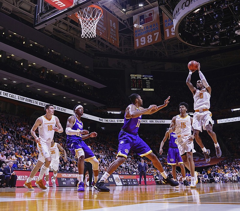 Tennessee point guard Jordan Bone, far right, takes a jump shot during the Vols' home win against Tennessee Tech last Saturday. The Vols open SEC play today in Knoxville against Georgia.