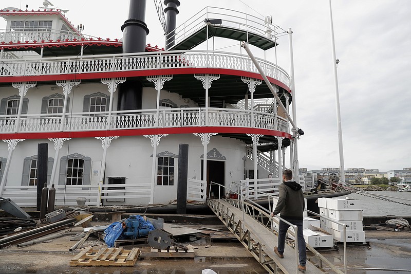 In this Nov. 29, 2018, photo, Matt Dow, project manager for the restoration of the "City of New Orleans" riverboat, walks on the vessel in New Orleans. The new paddlewheel riverboat is ready to ride the Mississippi, set to begin taking tourists on excursions around New Orleans starting in late January. The City of New Orleans will be the third paddlewheeler to call this Southern city of Mardi Gras fame its home. (AP Photo/Gerald Herbert)