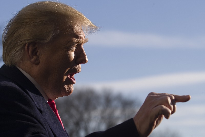 President Donald Trump speaks on the South Lawn of the White House as he walks from Marine One last Sunday in Washington. (AP Photo/Alex Brandon)