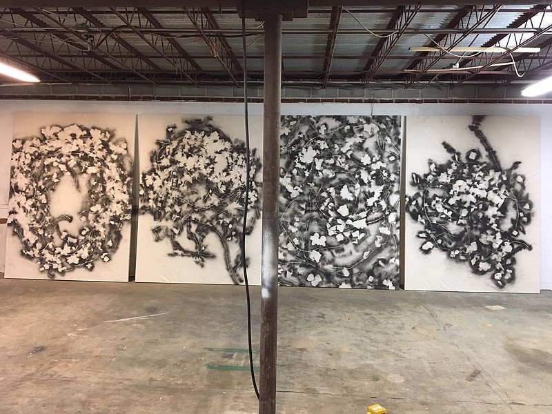 Jeffrey Morton's kudzu art was made by arranging the vine on white canvas, coating the canvas with black spray paint, then removing the vine to creative a negative image. The four large pieces, shown, will be stacked on the gallery floor. The vine will appear to be moving upward, just like it grows. (Contributed photo by Jeffrey Morton)
