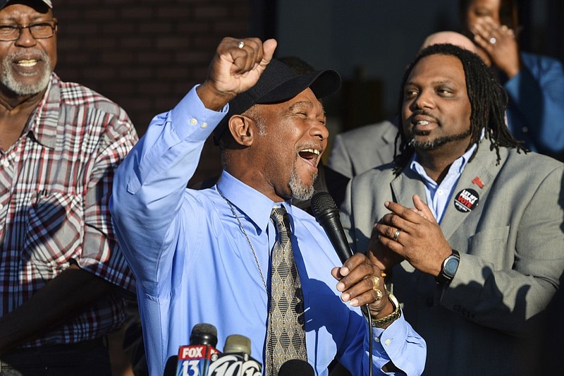 Pastor Wesley Tunstall praises God while addressing media at the Sarasota County Supervisor of Elections Office on Tuesday, Jan. 8, 2019, in Sarasota, Fla. Tunstall, a convicted felon, registered to vote on Tuesday, the first day that Amendment 4, which restores the right to vote for most felons, went into effect. (Dan Wagner/Sarasota Herald-Tribune via AP)

