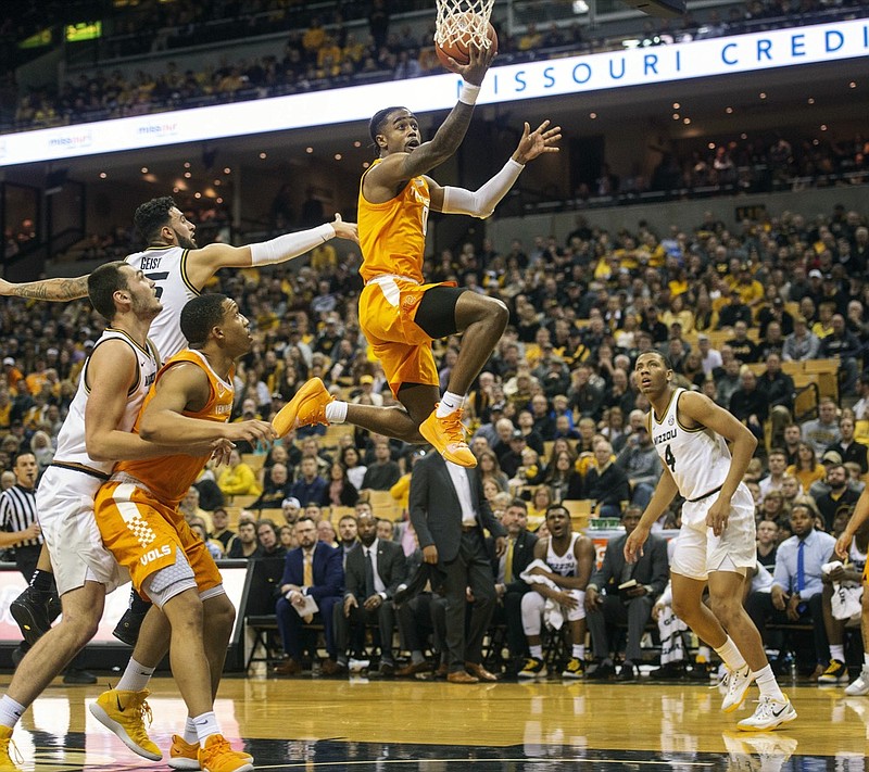 Tennessee's Jordan Bone, center, shoots between Missouri defenders during the first half of an NCAA college basketball game Tuesday, Jan. 8, 2019, in Columbia, Mo. (AP Photo/L.G. Patterson)

