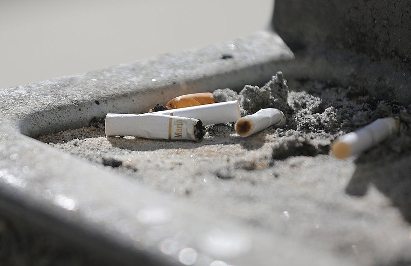 Used cigarettes sit in a trashcan ashtray outside the Hamilton County-Chattanooga Courts Building Wednesday, January 9, 2019 in Chattanooga, Tennessee. Studies show that the cost of smoking cigarettes can create a significant financial burden on smokers, with smokers in some states seeing that more than others.