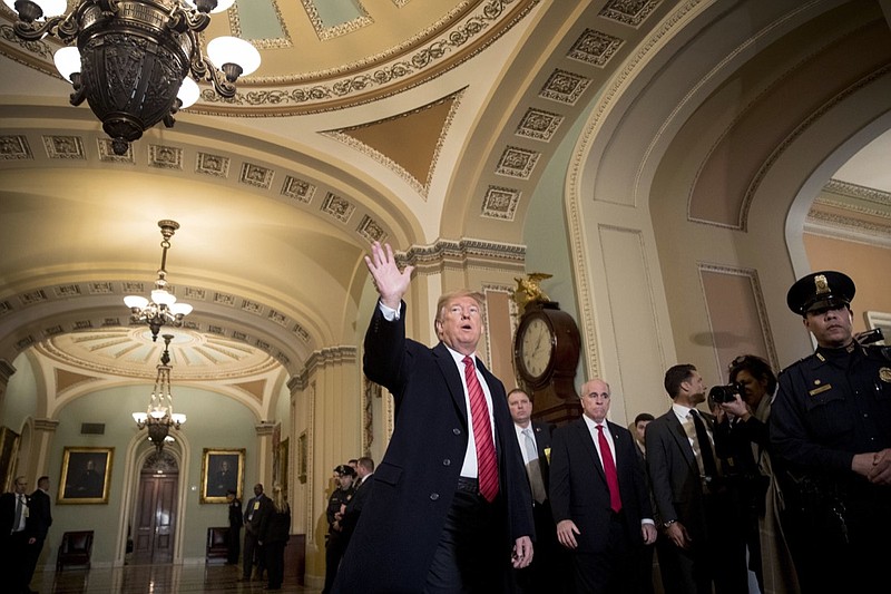 President Donald Trump, accompanied by Vice President Mike Pence, waves to members of the media as he arrives for a Senate Republican Policy lunch on Capitol Hill in Washington, Wednesday, Jan. 9, 2019. (AP Photo/Andrew Harnik)