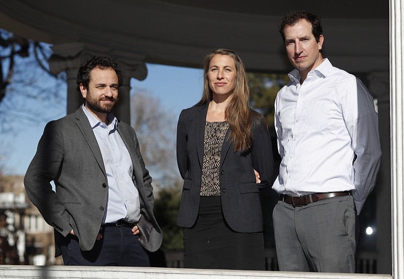 In this Thursday, Dec. 20, 2018, photo, attorneys, from left, David Seligman, Nina DiSalvo and Alexander Hood of Denver's Towards Justice are shown outside the organization's office east of downtown Denver. In a deal filed Wednesday, Jan. 9, 2019, in federal court in Denver, the companies that brought workers from around the globe to provide low-cost child care for American families have offered $65.5-million to settle a class-action lawsuit with nearly 100,000 au pairs. (AP Photo/David Zalubowski)

