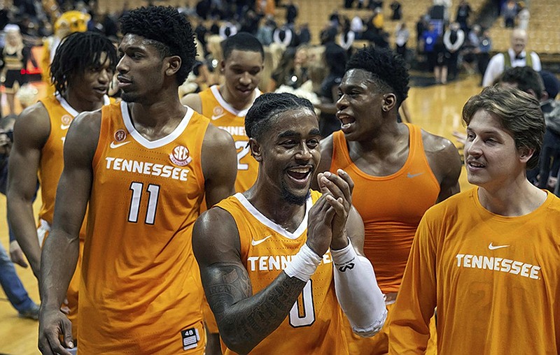 Tennessee point guard Jordan Bone, center, and his teammates leave the court after their 87-63 victory over Missouri on Tuesday night in Columbia, Mo. Bone had 17 points as one of four Vols who scored in double figures.