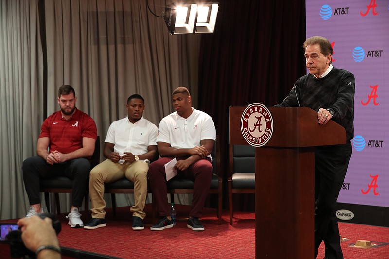 Alabama football coach Nick Saban, right, speaks at a news conference Friday as, from left, left tackle Jonah Williams, running back Josh Jacobs and defensive tackle Quinnen Williams prepare to announce their intentions to turn pro. Tight end Irv Smith Jr. did not attend the conference but said he will enter the draft as well.